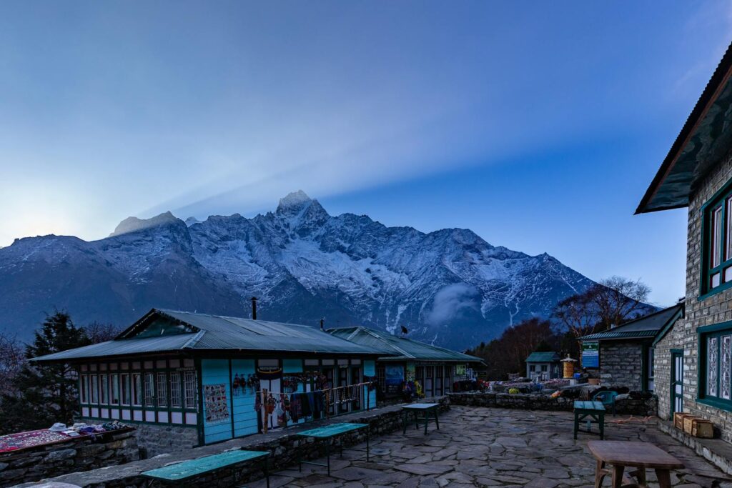 Explore the serene lodges in Nepal with a scenic Himalayan backdrop.