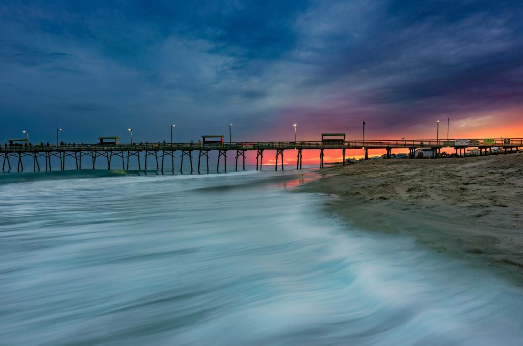 A breathtaking view of Emerald Isle Pier in North Carolina, captured at dusk with long exposure.