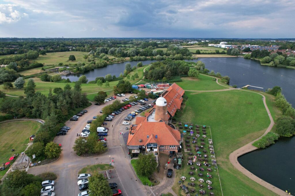 Scenic aerial photo showcasing lush landscapes, lakes, and leisure area in Milton Keynes, UK.