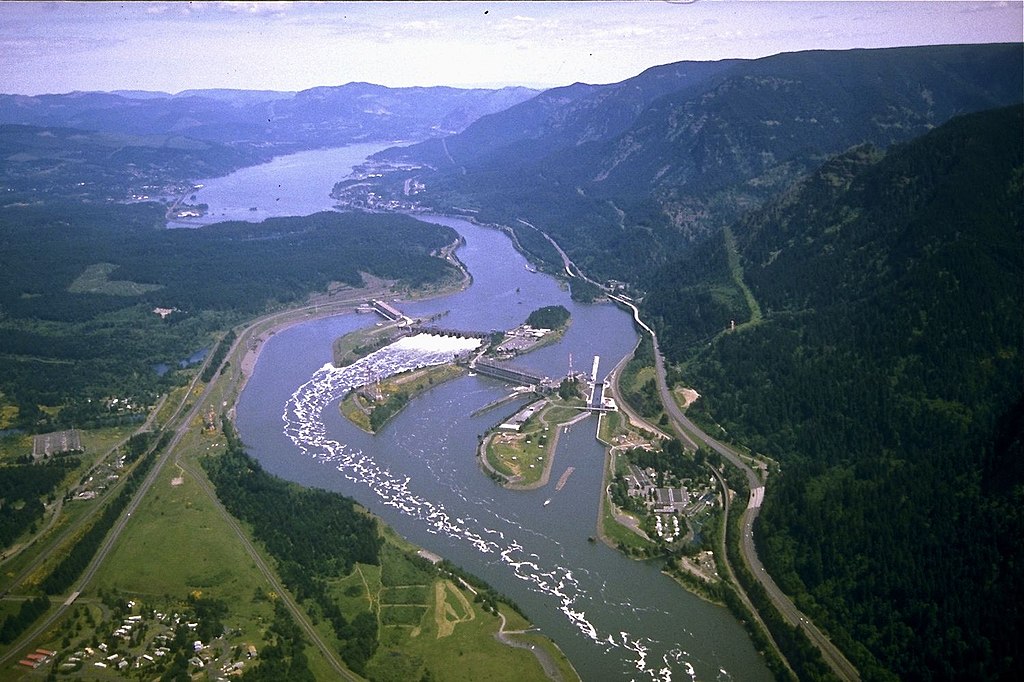 Aerial view of Bonneville Dam, in the Columbia River Gorge, looking east. the bend visible in the river is a vestige of the original "Bridge of the Gods" land bridge.
