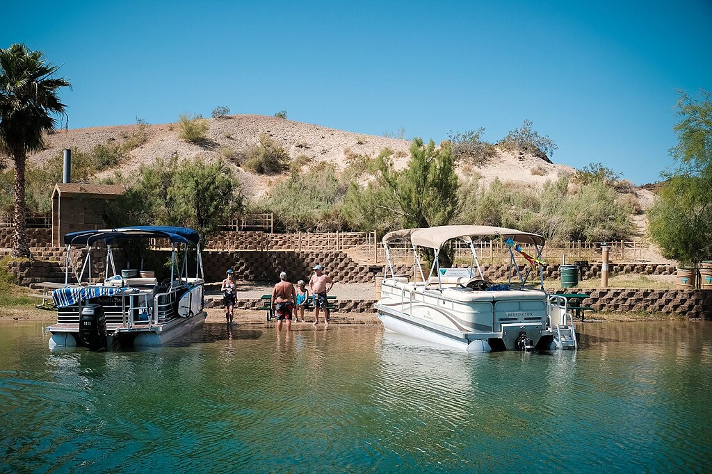 Bureau of Land Management park rangers chat with visitors to a boat-in campsite on Lake Havasu. The sites provide a unique recreation opportunity for visitors to the area.