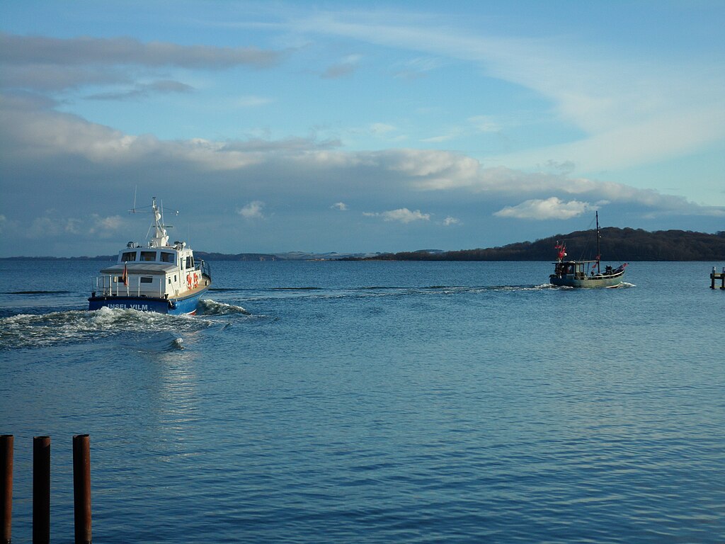 Two boats taken in the harbour Lauterbach (Rügen) and in the background island Vilm.