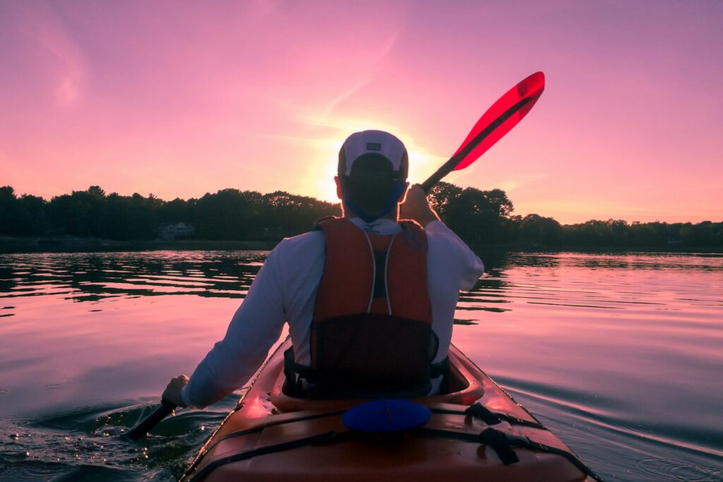 A man riding on kayak.