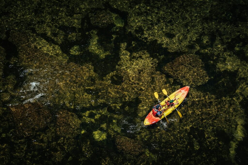 An aerial view of a kayak in the water
