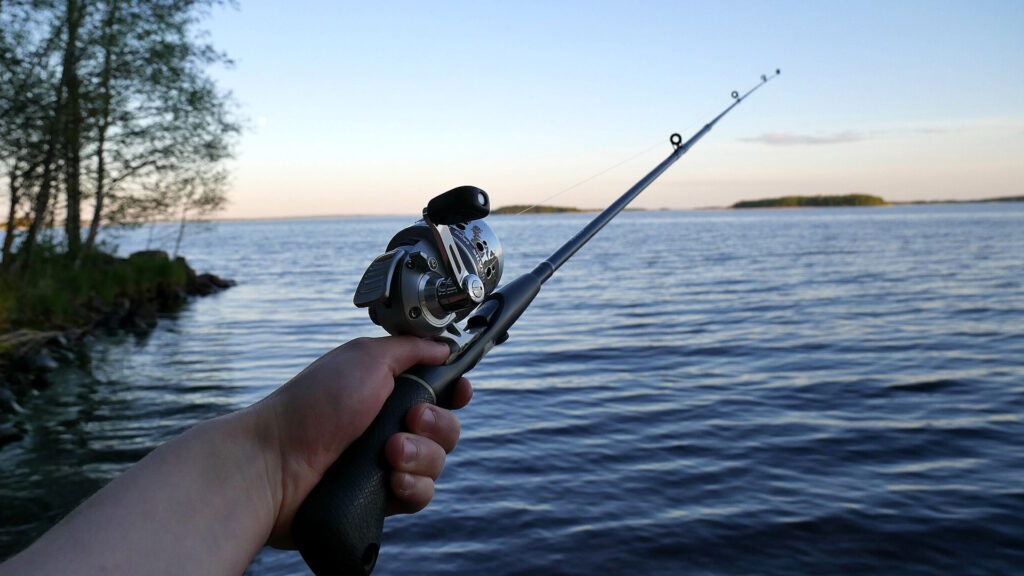 Hand holding a fishing rod