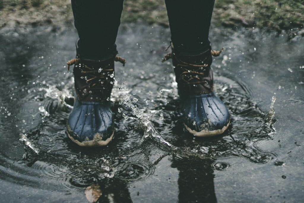 Person standing on splashed water.