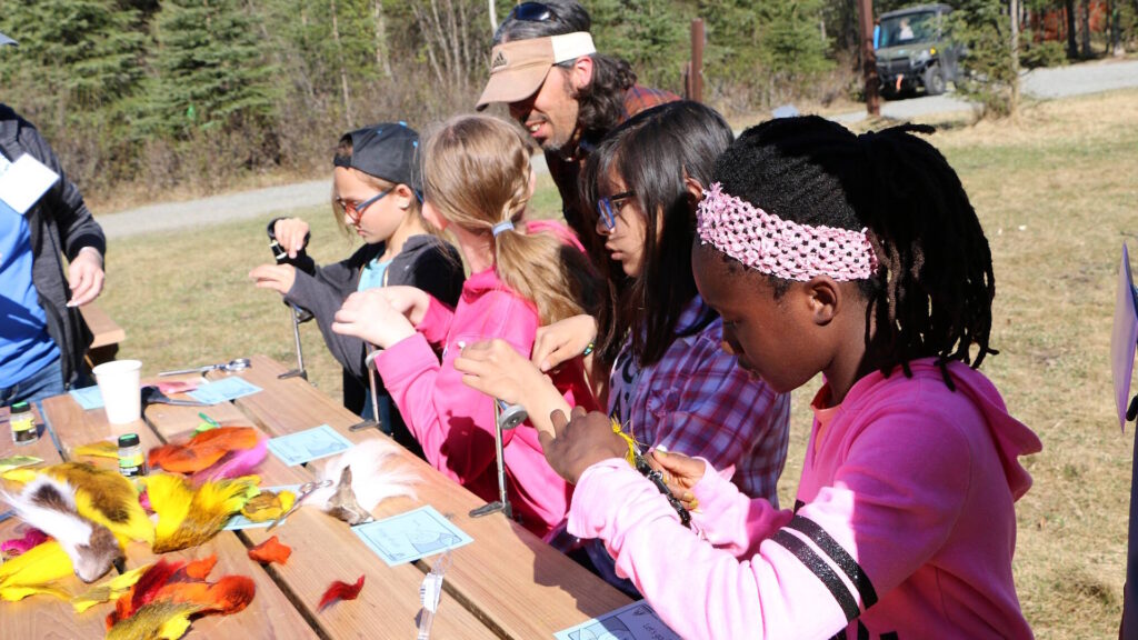 Students learn how to tie flys at Outdoor Week