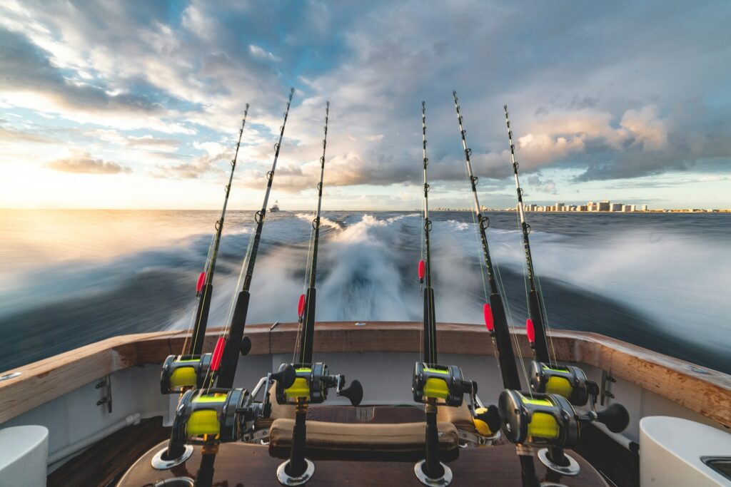 Six black-and-yellow fishing rod in boat.