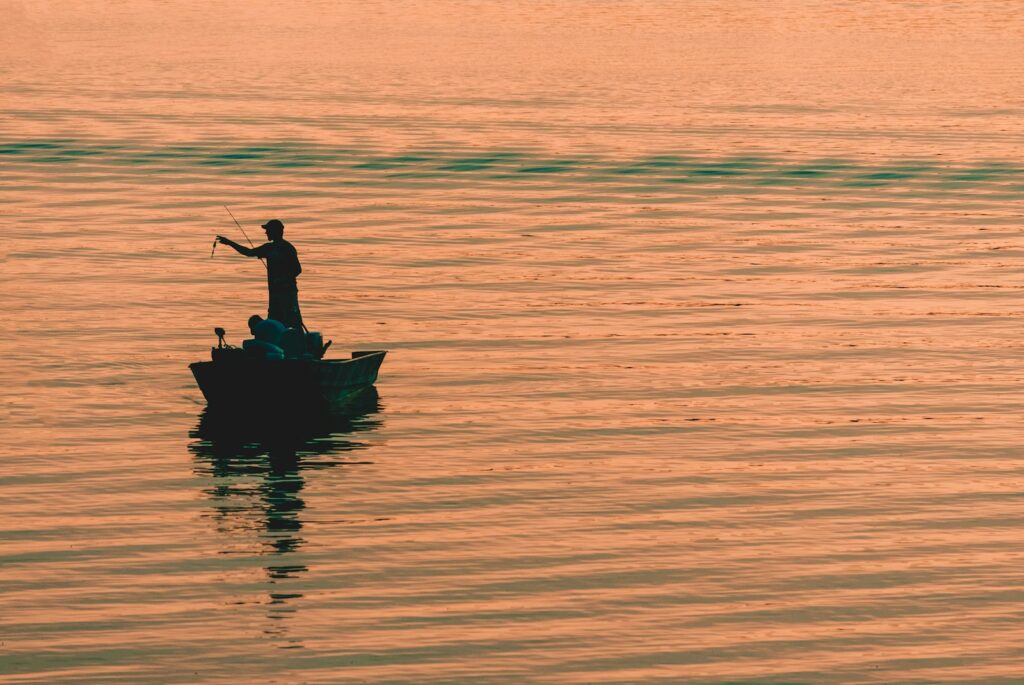 Person on boat fishing.