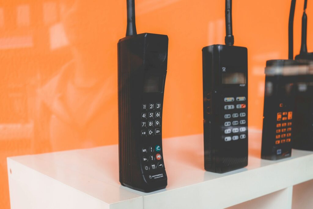 black home phones on white rac k