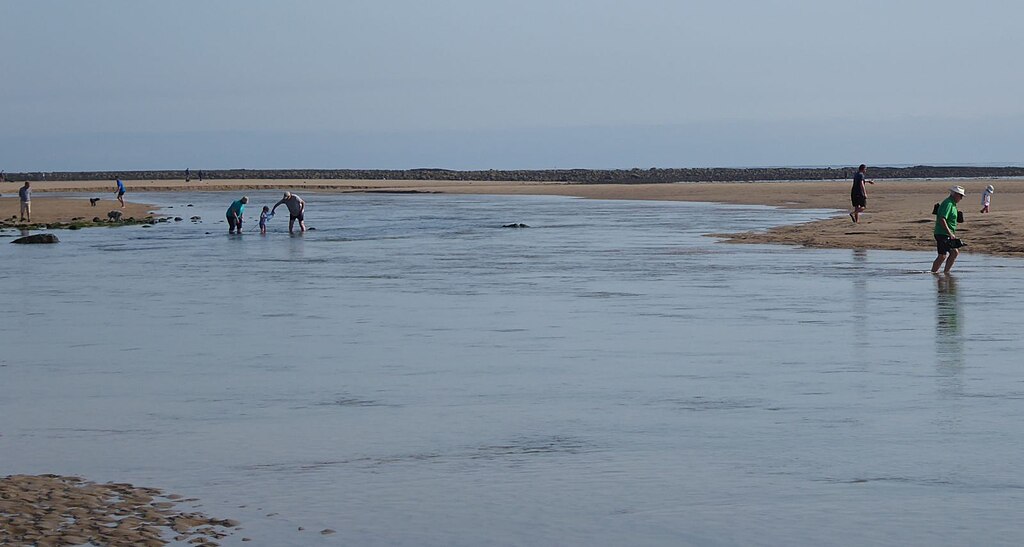 Wading across the River Aln.