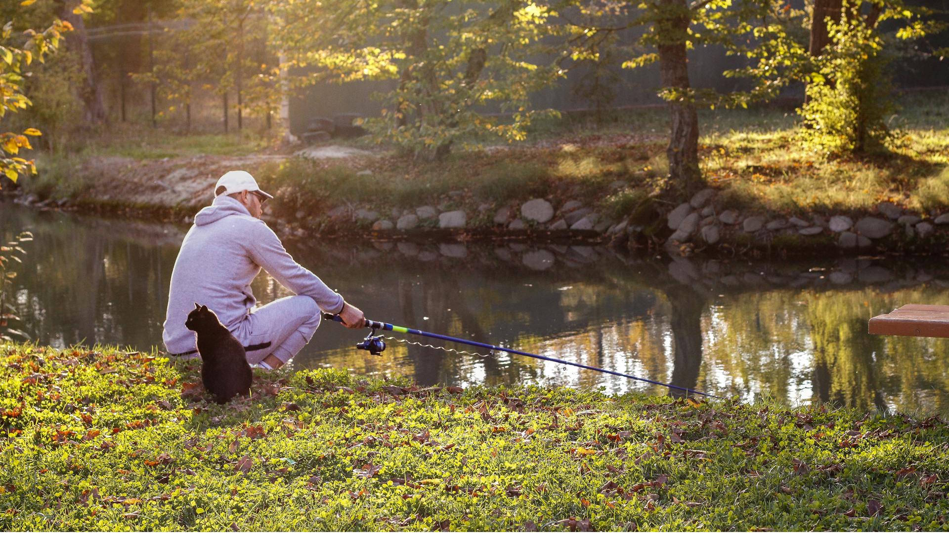 Angler with a black fishing in the river