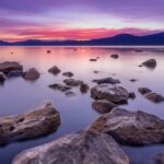 body of water during sunset